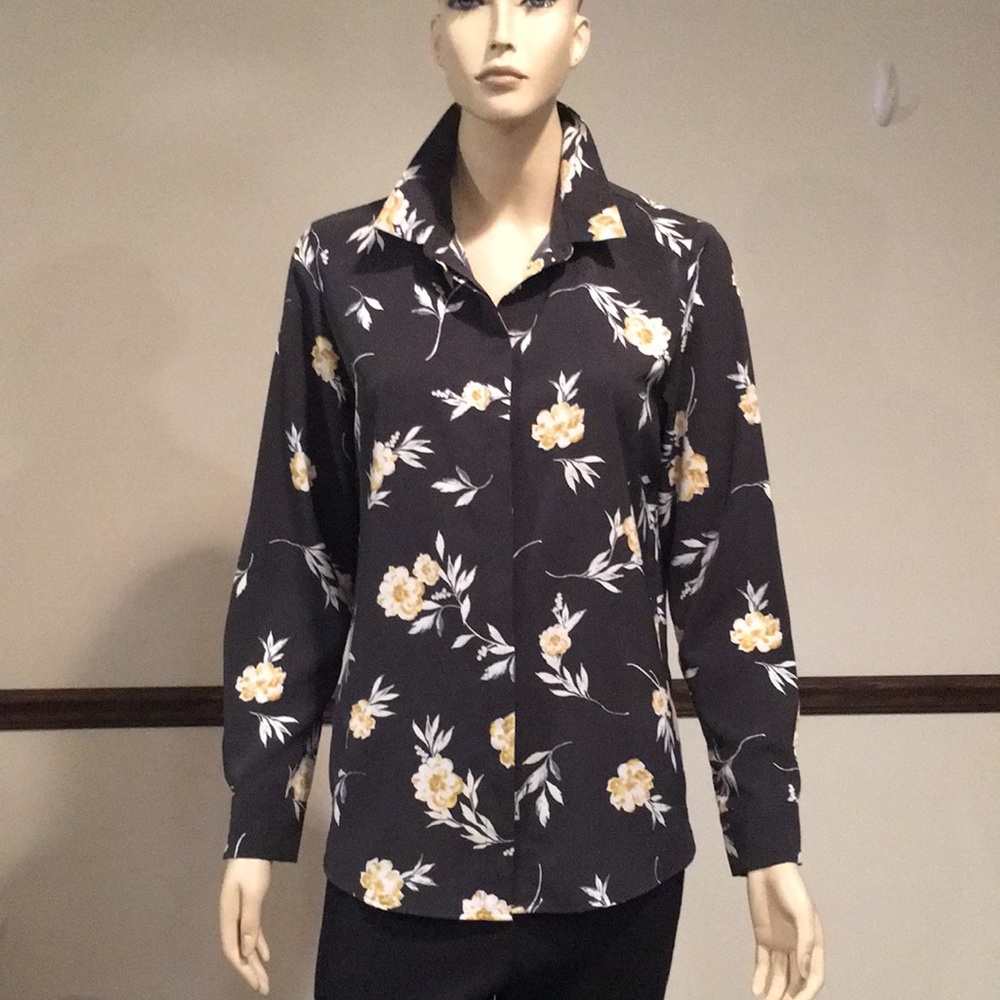 Long sleeved button up blouse.